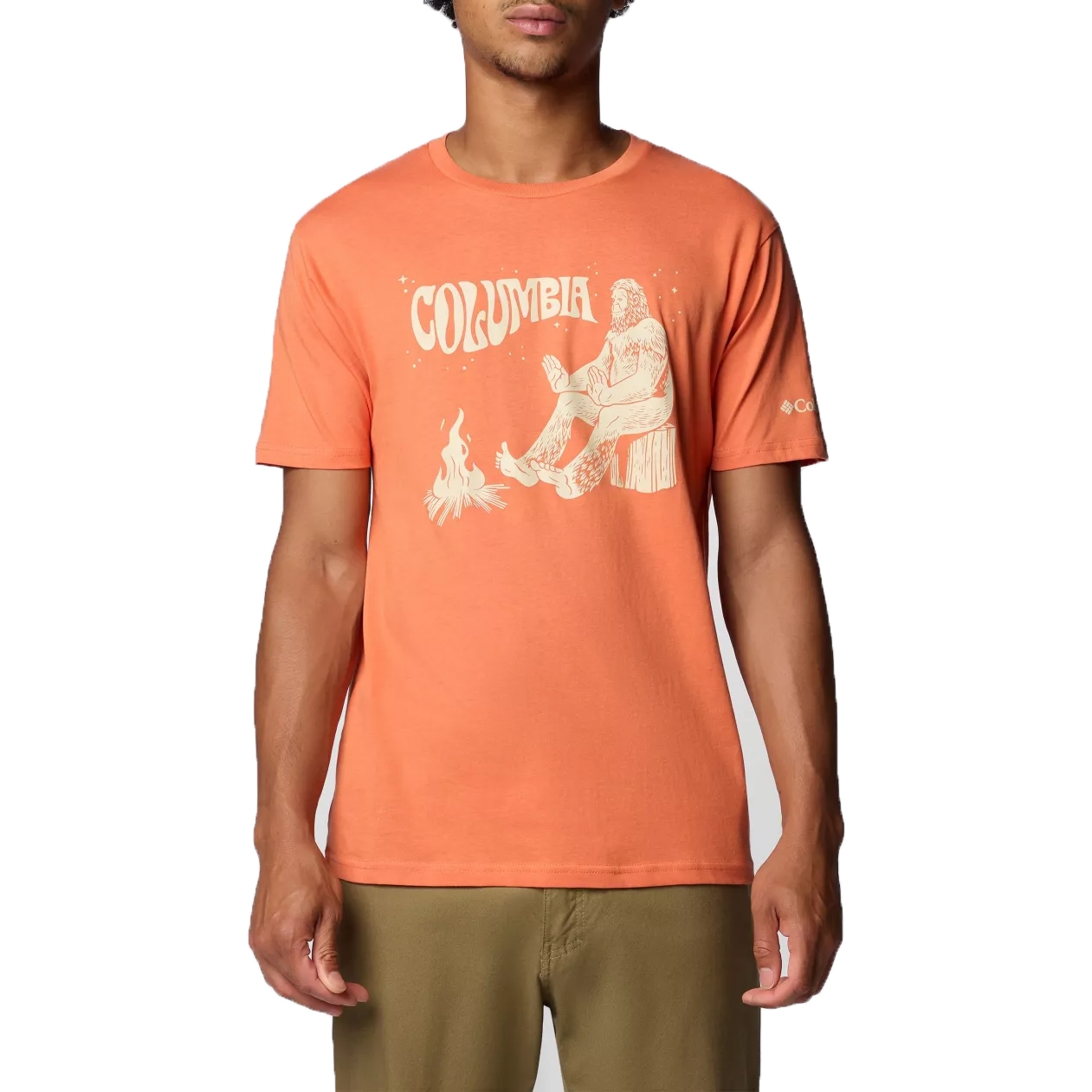 Orange Columbia t-shirt featuring a graphic of a Sasquatch-like figure sitting by a campfire, short sleeves, and Columbia logo on the left sleeve.