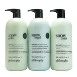 Three Philosophy hydrating shower gels: Snow Globe, Snow Angel, and Snow Man, each in 946/947 ml (32 fl. oz.) bottles with descriptions emphasizing seasonal scents like crisp apple, winter gardenias, and jasmine.
