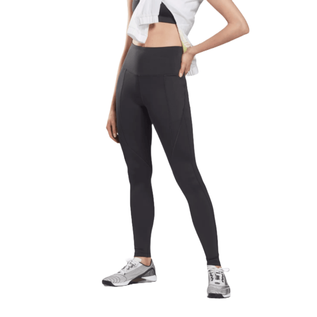 Reebok High Rise Leggings are black, form-fitting, and feature a wide waistband for comfort and support. Ideal for workouts, they pair well with sneakers.