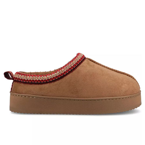 Tan suede slippers with a thick, flat sole and red embroidered trim around the opening. They feature a pull tab at the heel for easy wearing.