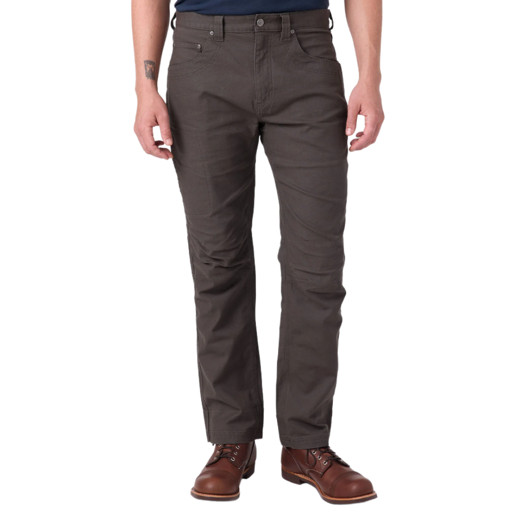 A person wearing dark brown pants paired with brown leather boots.