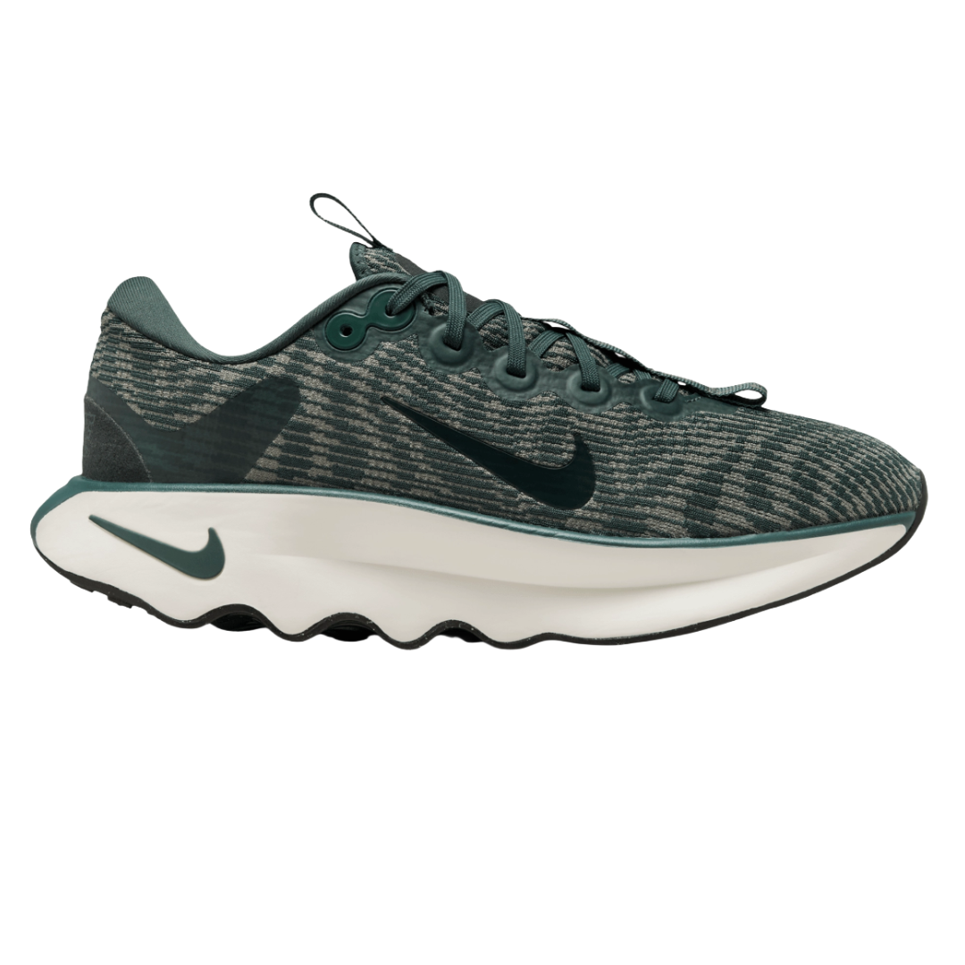 A dark green athletic sneaker with a wavy white sole and a patterned upper featuring a prominent swoosh logo.