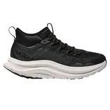 A black athletic shoe with a textured upper and a thick, white, wavy sole, designed for comfort and support.