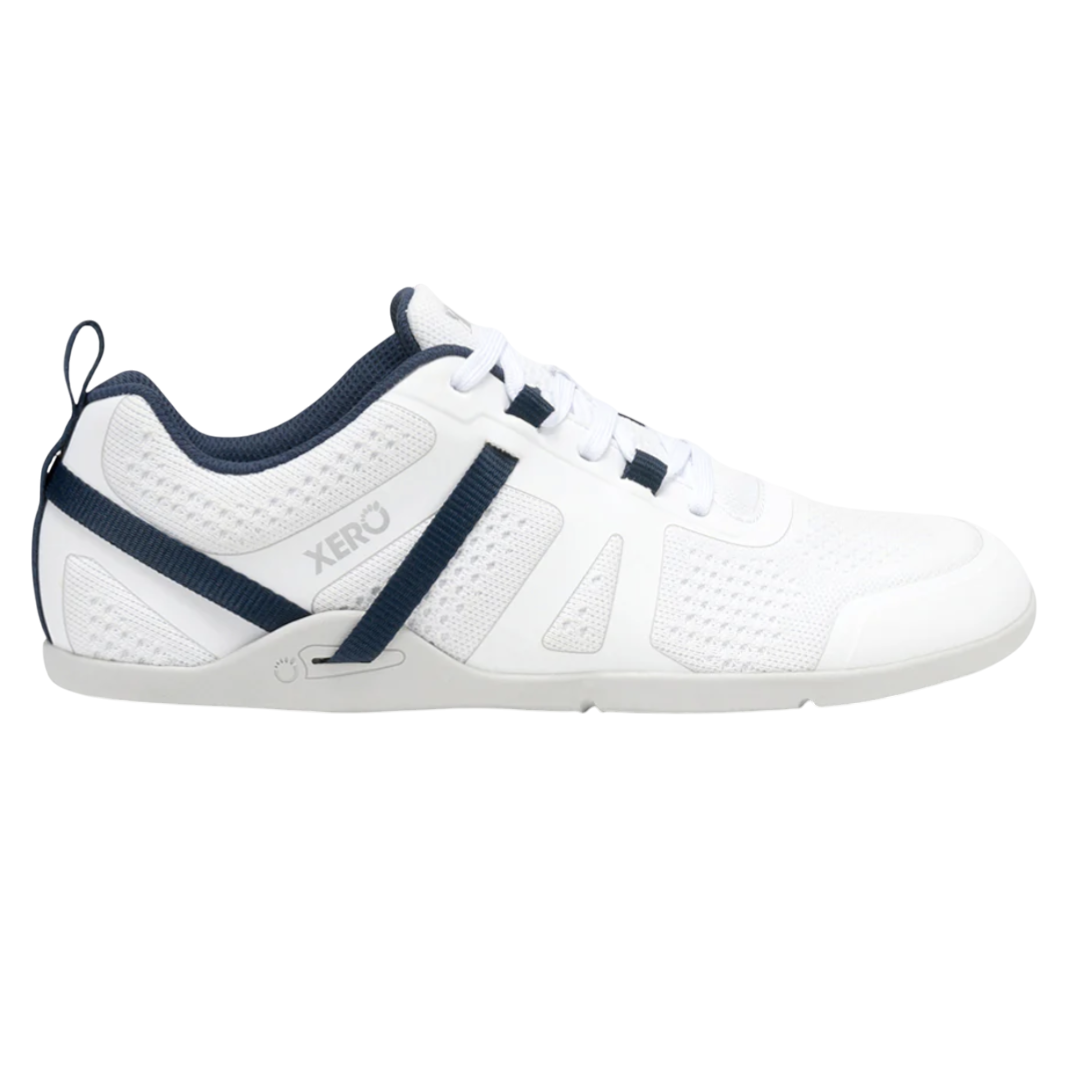 White athletic shoe with a mesh design, featuring navy accents and laces. The brand name \“Xero\“ is visible on the side.