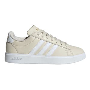 Adidas Gamecourt Shoes feature a sleek beige design with white stripes and logo detailing. They have a minimalist style, lace-up closure, and a cushioned white sole for comfort.