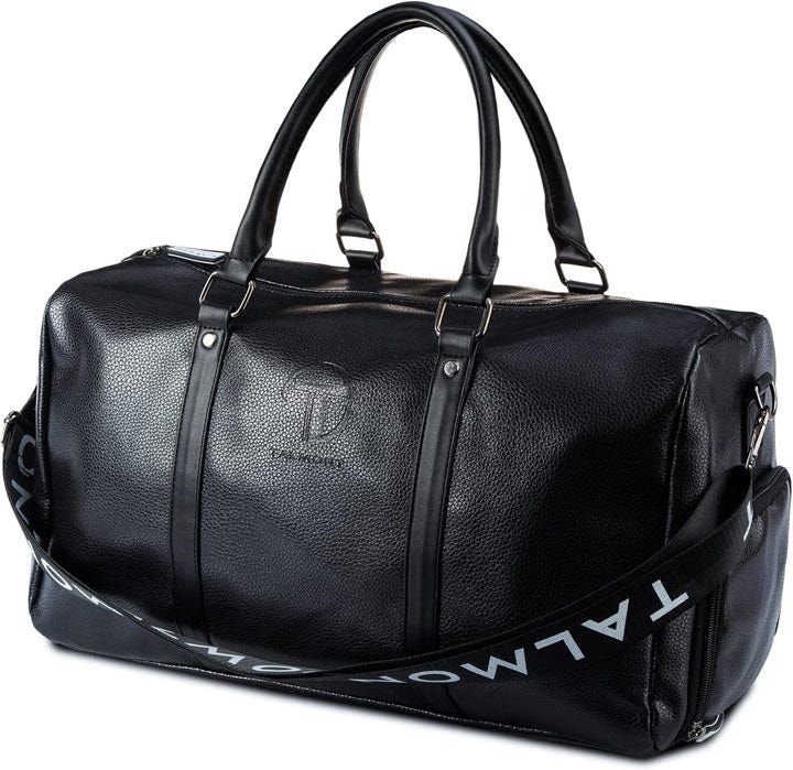 Black leather duffel bag with dual handles and an adjustable shoulder strap, featuring a subtle embossed logo and a detachable strap with \“TALMONT\“ branding.