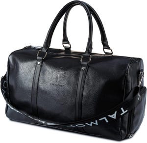 Black leather duffel bag with dual handles and an adjustable shoulder strap, featuring a subtle embossed logo and a detachable strap with \“TALMONT\“ branding.