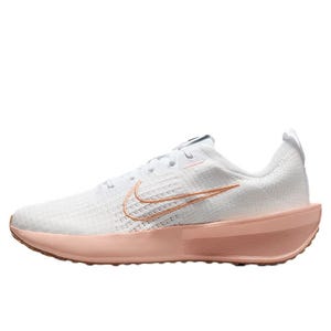 White and pink running shoe featuring a mesh upper, pink midsole, and a swoosh logo.
