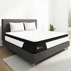 A modern bed setup with a plush Avenco mattress and two white pillows, set in a minimalistic room with a gray fabric bed frame and a snake plant by the window.