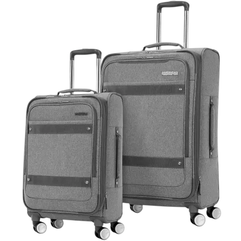 Two grey wheeled suitcases with telescopic handles, featuring front pockets and a four-wheel system for easy mobility.
