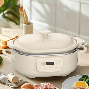 A 4-quart capacity cooking appliance with a digital interface, suitable for tasks like slow cooking and rice preparation, is set on a kitchen counter surrounded by food items.