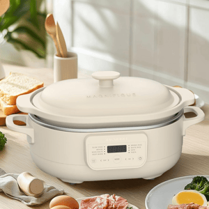 A 4-quart capacity cooking appliance with a digital interface, suitable for tasks like slow cooking and rice preparation, is set on a kitchen counter surrounded by food items.