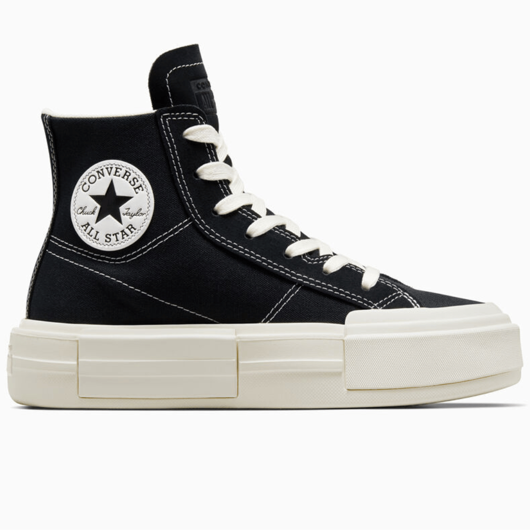 High-top, black Converse Chuck Taylor All Star sneakers with a thick white platform sole.