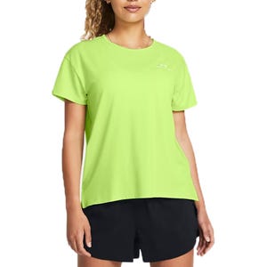A woman is wearing a bright green UA Vanish Energy Shirt, featuring short sleeves and a relaxed fit, paired with black shorts.