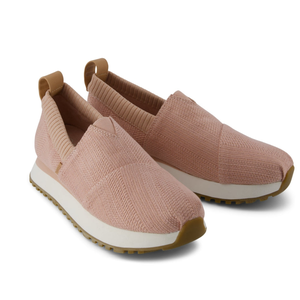 Pink slip-on sneakers with a knitted fabric upper, elasticated collar, white midsole, and textured gum sole.