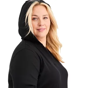 A person wearing a black hooded garment.