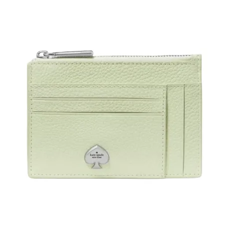 A light green leather card holder with multiple card slots, a zippered compartment, and a metal spade logo in silver at the front.