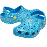 Blue Crocs with a splatter paint design featuring yellow and white specks, equipped with adjustable back straps and perforated toe boxes for ventilation.