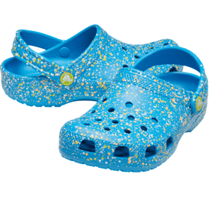 Blue Crocs with a splatter paint design featuring yellow and white specks, equipped with adjustable back straps and perforated toe boxes for ventilation.
