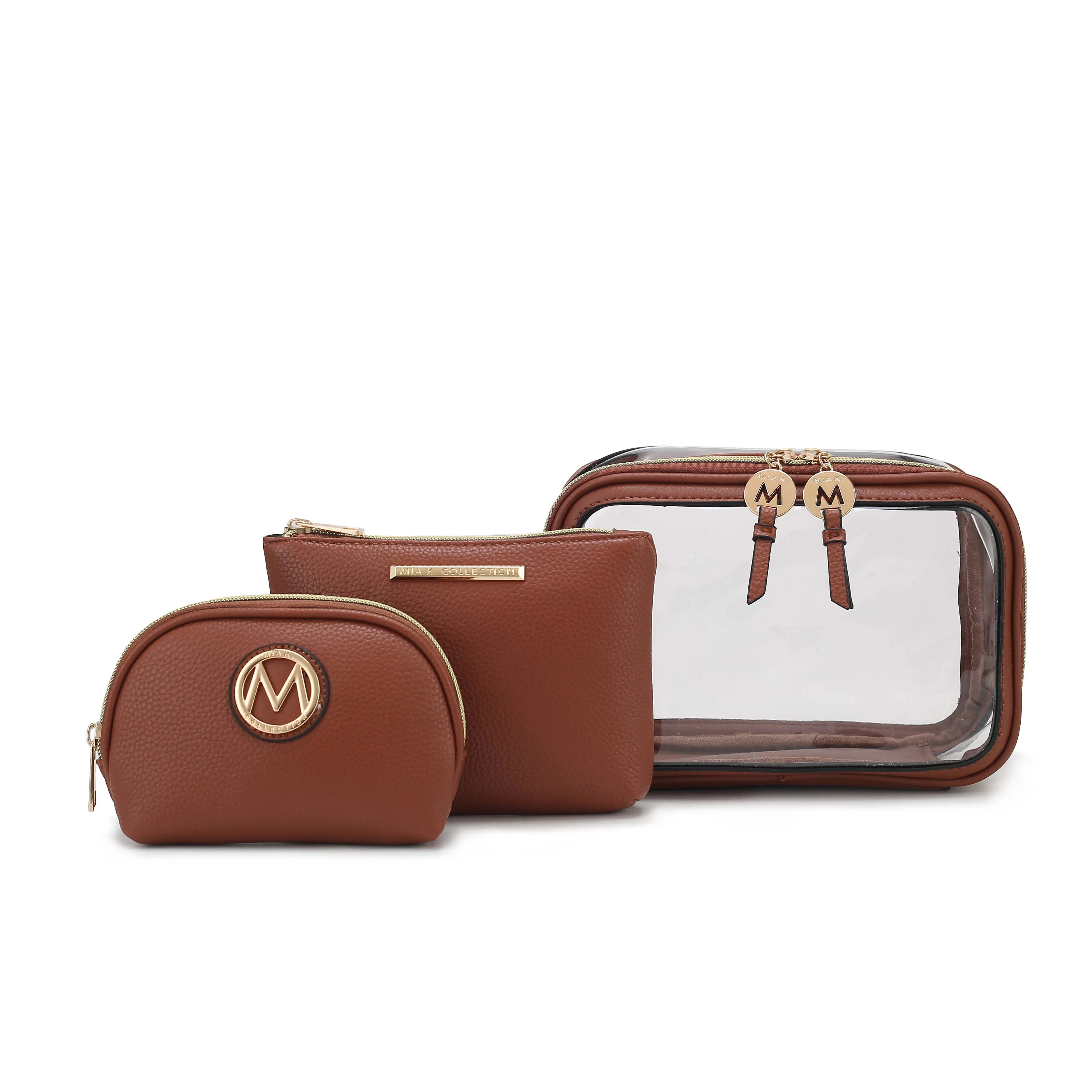 A set of three brown cosmetic bags, including a small pouch with a gold \“M\“ logo, a medium pouch with a gold label, and a large pouch with a clear front and dual zippers, each featuring a gold medallion with an \“M.\“