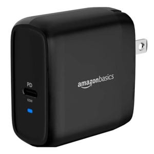 Black AmazonBasics 65W USB-C power adapter with a power delivery (PD) port and an LED indicator.
