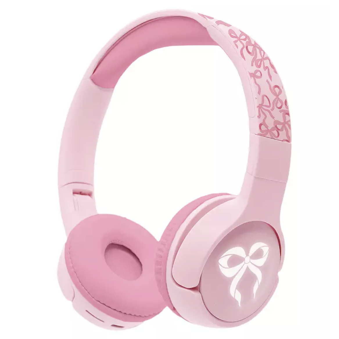Pink over-ear headphones with a ribbon design on the headband and a glowing bow icon on the ear cup.