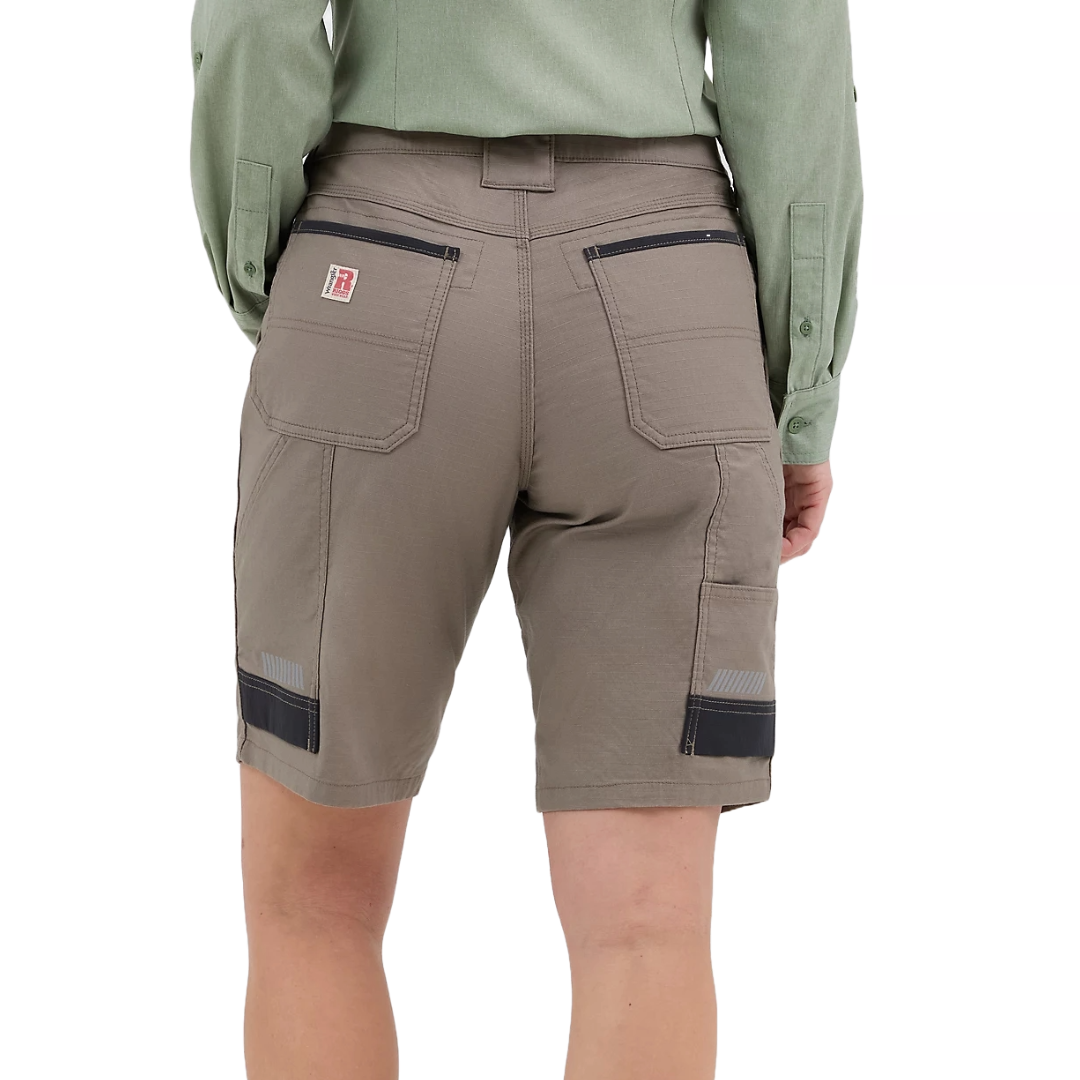 Wrangler Women's Carpenter Shorts are versatile shorts featuring multiple pockets, reinforced stitching, and loop detailing, ideal for casual or workwear settings. They come in a neutral tone with a relaxed fit.