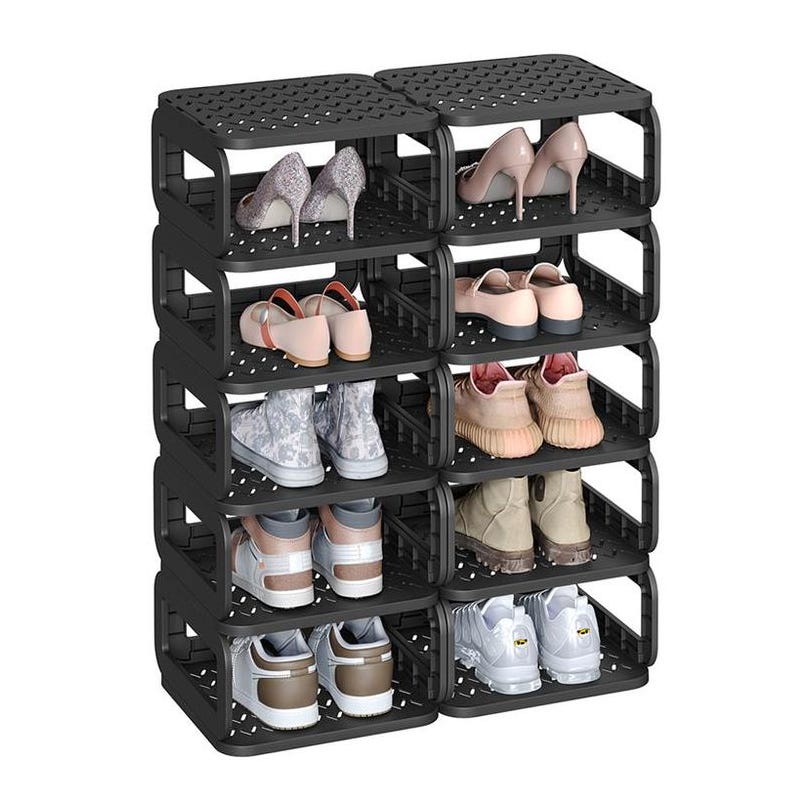 A black, 12-tier shoe rack made of plastic holds various footwear, including sneakers, high heels, and casual shoes, with each tier accommodating a pair.