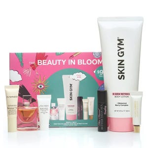 Beauty in Bloom set featuring Skin Gym R-Dew Retinol Body Lotion and various samples, including MAC Hyper Real Serum, Shiseido Benefiance, Better Than Sex Mascara, and Dolce & Gabbana fragrance. Total value advertised as $97.
