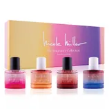 Nicole Miller The Fragrance Collection includes four eau de parfum scents: Lueur De La Ville, Nectar De Pêche, Mystique, and Sirène, presented in a colorful gradient box.