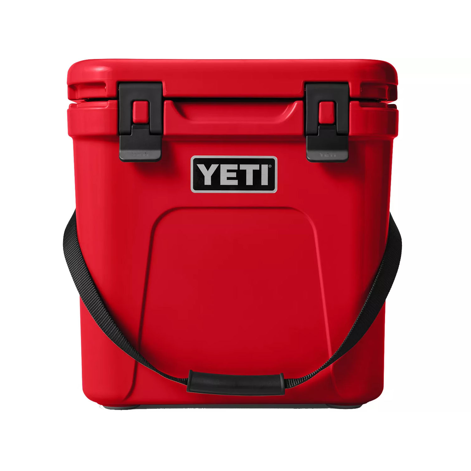 Red YETI cooler with a black carry strap and secure latch closures, designed for durable outdoor use.