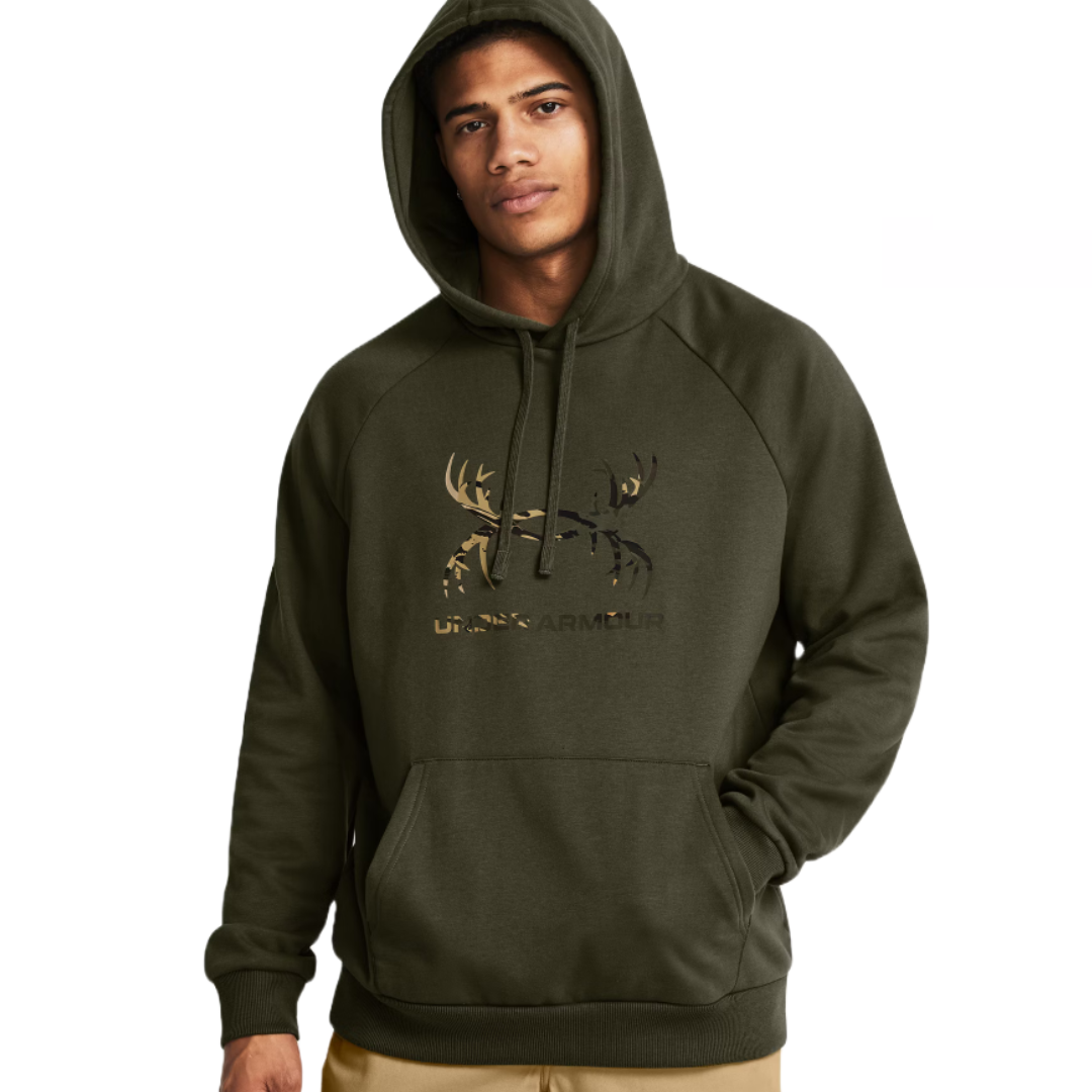 UA Rival Fleece Hoodie in dark green features a drawstring hood, kangaroo pocket, and a deer-antler motif with \“Under Armour\“ branding on the chest.