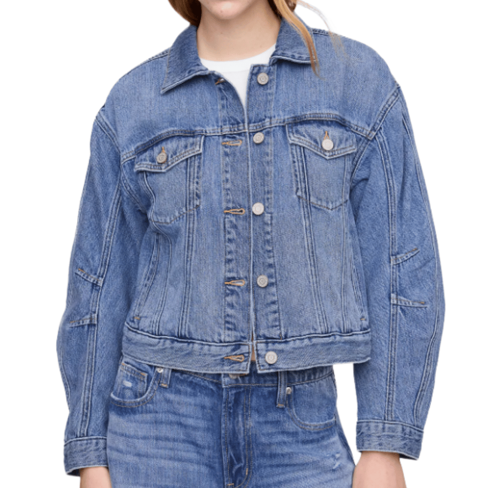 A blue denim jacket with front button closure, chest pockets, and seam detailing, paired with matching blue denim jeans.