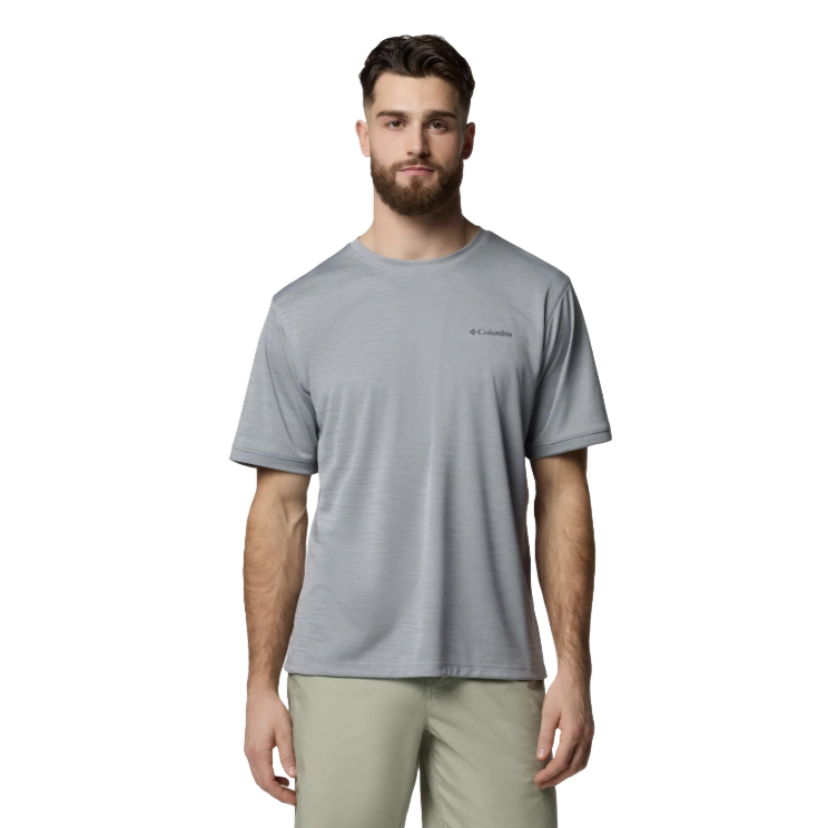A man wearing a light grey Columbia short-sleeve t-shirt and light pants, standing against a plain white background.