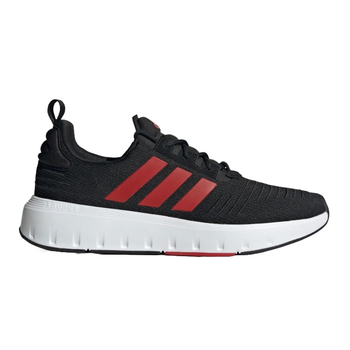 Black athletic shoe with red stripes and a white sole.