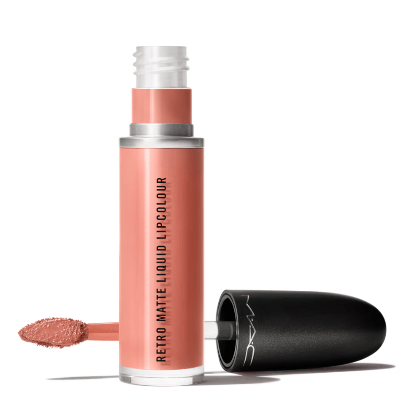 A tube of MAC Retro Matte Liquid Lipcolour in a peachy shade, with an applicator wand partially extended.
