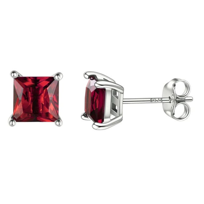 Square-cut red gemstone stud earrings set in silver with a secure four-prong setting and butterfly backings, marked with \“925\“ for sterling silver.