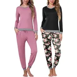 Two women are wearing comfortable pajama sets; one is pink with grey accents, and the other is a black top with floral-print pants, both featuring long sleeves and cuffed hems.