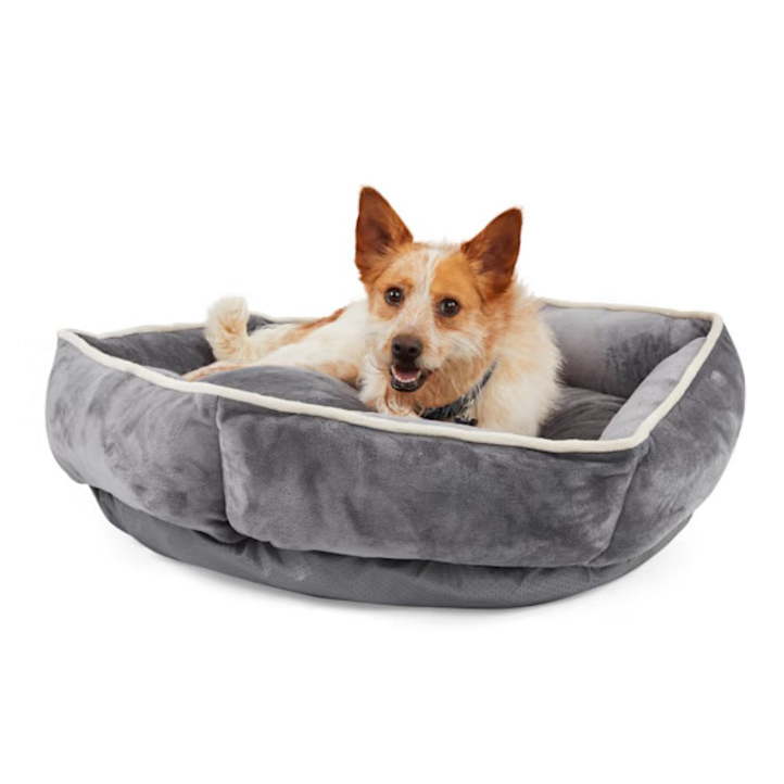 EveryYay Snuggler Dog Bed is a cozy, rectangular pet bed with raised edges and a soft, plush gray exterior designed for comfort.