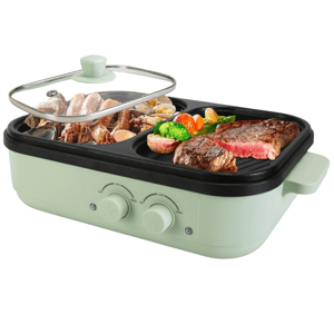 A multi-functional electric grill and hot pot combined, featuring dual temperature control dials, a transparent lid, and compartments for grilling meats and vegetables or steaming seafood.