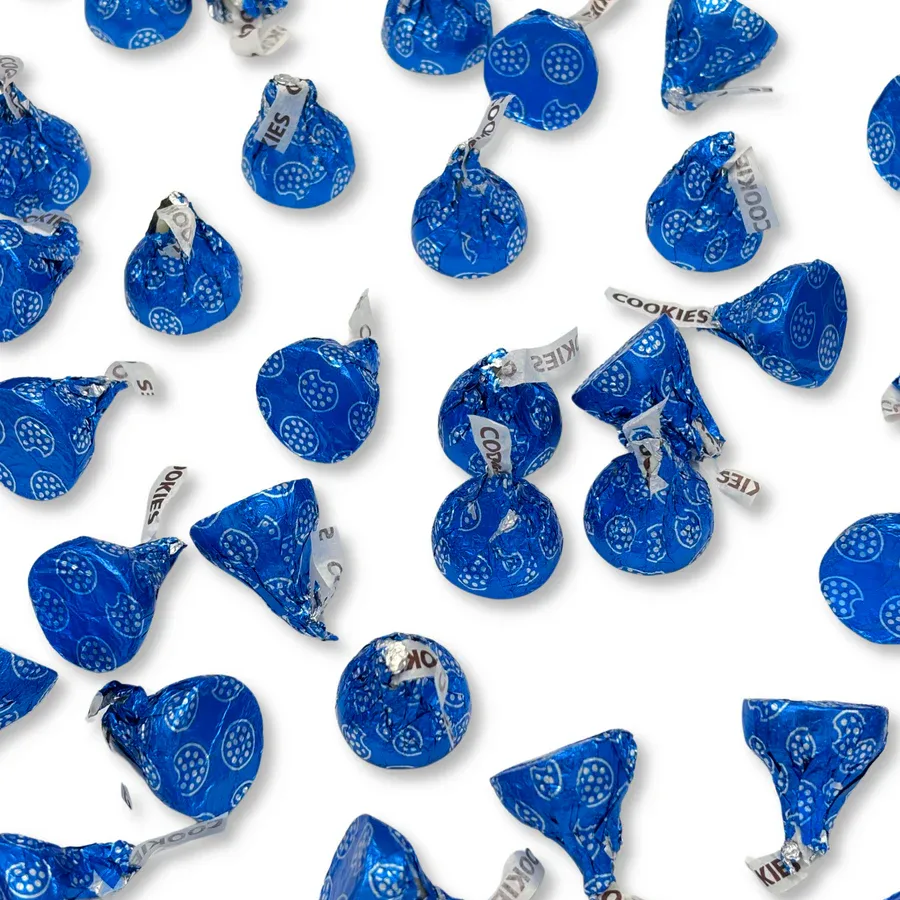 Hershey's Kisses with blue foil wrapping featuring cookie designs, labeled \“COOKIES\“ and \“KISSES\“ on the tags, totaling 5 pounds.