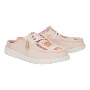 Pair of pink slip-on shoes with white soles, featuring colorful geometric embroidery on the upper and lace details with tassels.