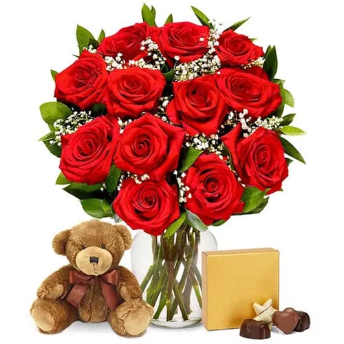 A dozen roses, chocolates, and a small teddy bear.