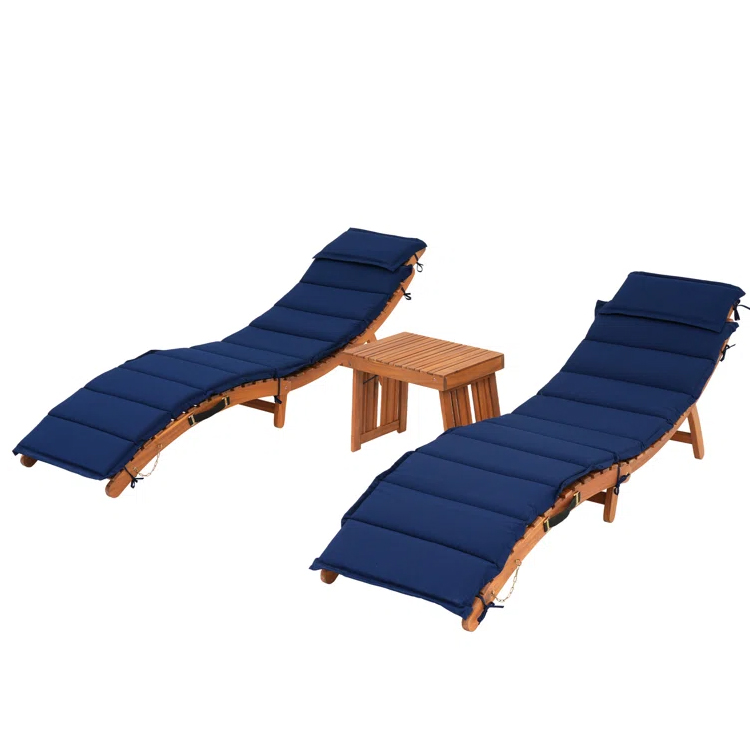 The 3pc Cushioned Lounge Chair Patio Set includes two curved wooden lounge chairs with navy blue cushions and a small matching wooden side table in between.