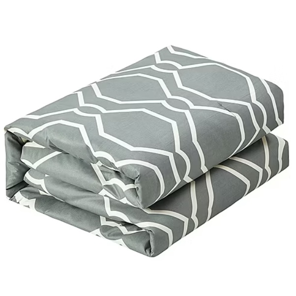 A folded gray bed sheet set featuring a white geometric pattern.
