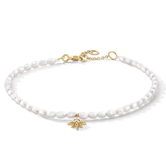 A pearl necklace with a gold star-shaped pendant and a gold chain clasp.