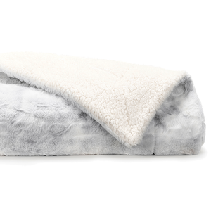 A soft faux-fur throw with a fluffy white interior and a light gray exterior, resembling a cozy blanket, perfect for warmth and comfort.
