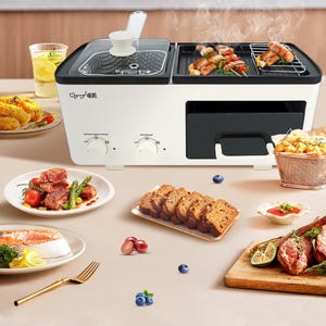 A multifunctional appliance featuring a deep fryer with a glass lid and a grill section for cooking. Surrounded by various foods, including meats, bread, and vegetables, highlighting its versatility.