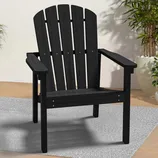 Black Adirondack chair with a slatted backrest, wide armrests, and set on a light gray rug.