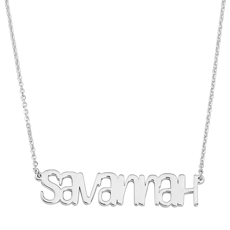 A silver necklace featuring the name \“Savannah\“ in a stylized script as a pendant. It includes a delicate link chain.